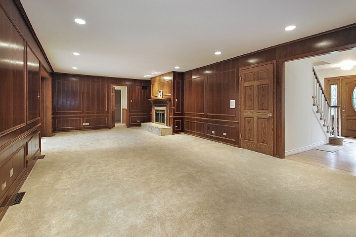 Living room in newly remodeled home with view into foyer